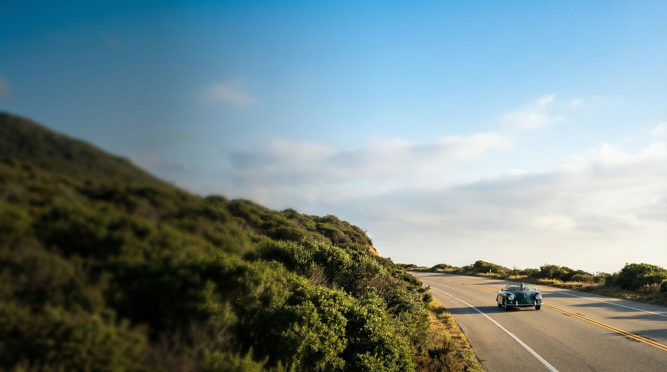 Vintage convertible on California coastal highway